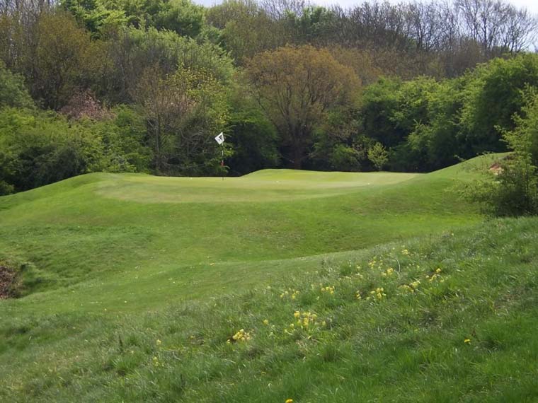 While the 128 yard 8th hole doesn’t offer a terrific view, it does provide for a demanding tee shot. The hole plays a bit uphill to a narrow green with no room to miss left. The front flag doesn't look a particularly inviting target.